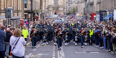 The Royal Edinburgh Military Tattoo Pipes And Drums march in the streets of Edinburgh in August 2026
