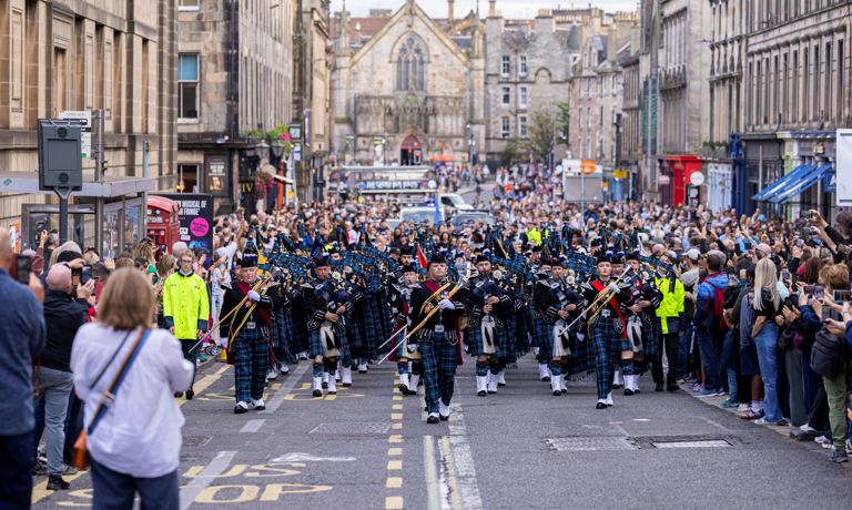 The Royal Edinburgh Military Tattoo Pipes And Drums march in the streets of Edinburgh in August 2026