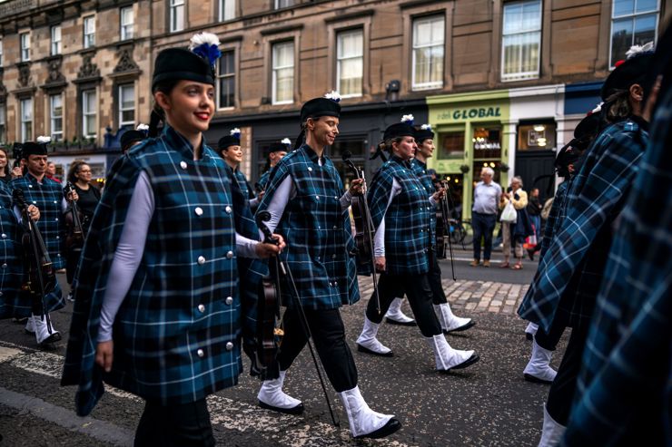The Royal Edinburgh Military Tattoo Fiddlers march in the streets of Edinburgh in August 2026