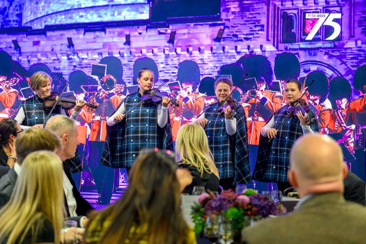 Fiddlers perform for diners in The Royal Gallery at The Tattoo